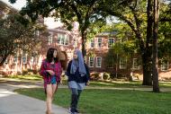 Two Beloit College students walk between classes near Morse-Ingersoll Hall.